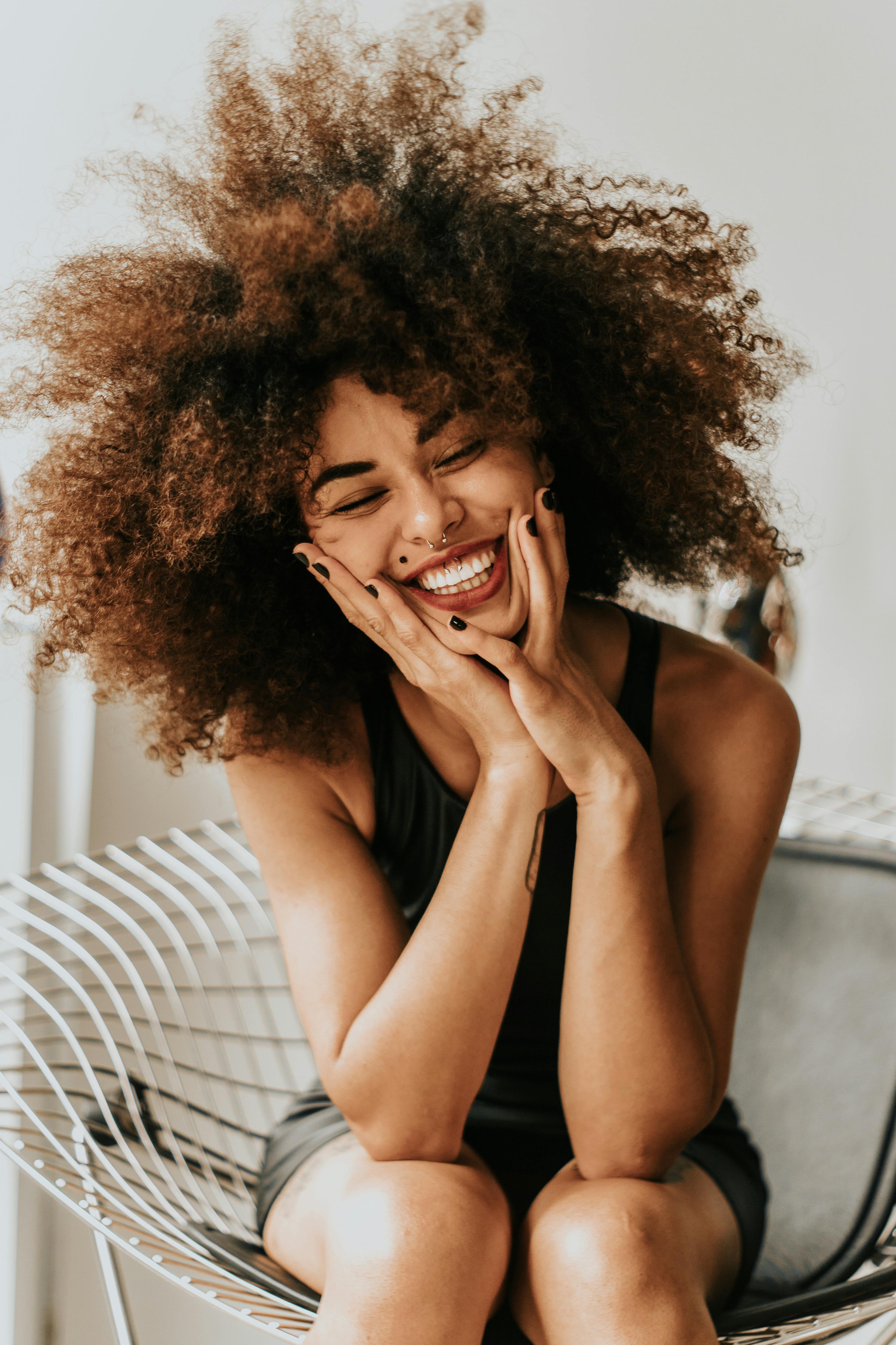Woman smiling freely, the joy of breaking silence